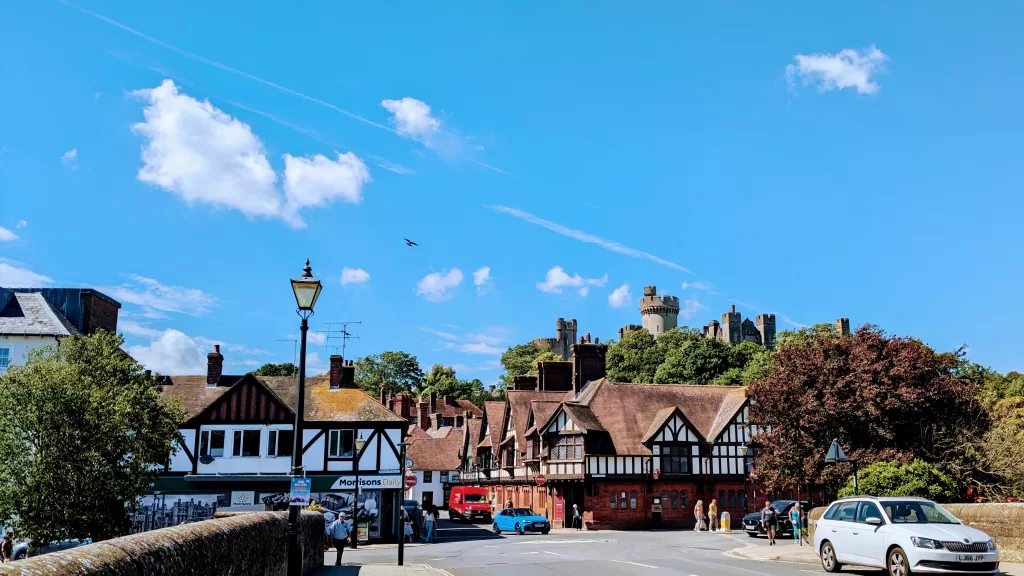 Tudor-style buildings of Arundel, with the castle on the hill in the background.