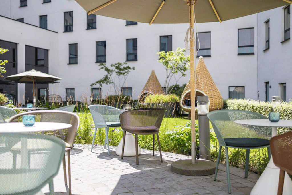 The Motel One Brussels, which has a modern outdoor seating area set in sunny courtyard.