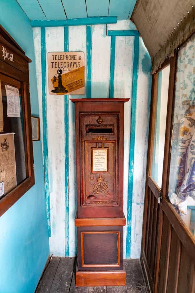A classic post office box with vintage signage in a rustic, wooden interior reminiscent of early 20th-century style. Sign up to our newsletter to get all the latest news from our sustainable travel blog.