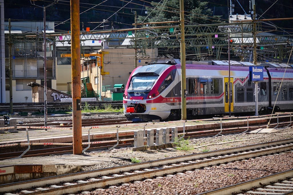 A passenger train at Bozen station in Trentino-SΓΌdtirol, Italy, showing how to get around Italy by train