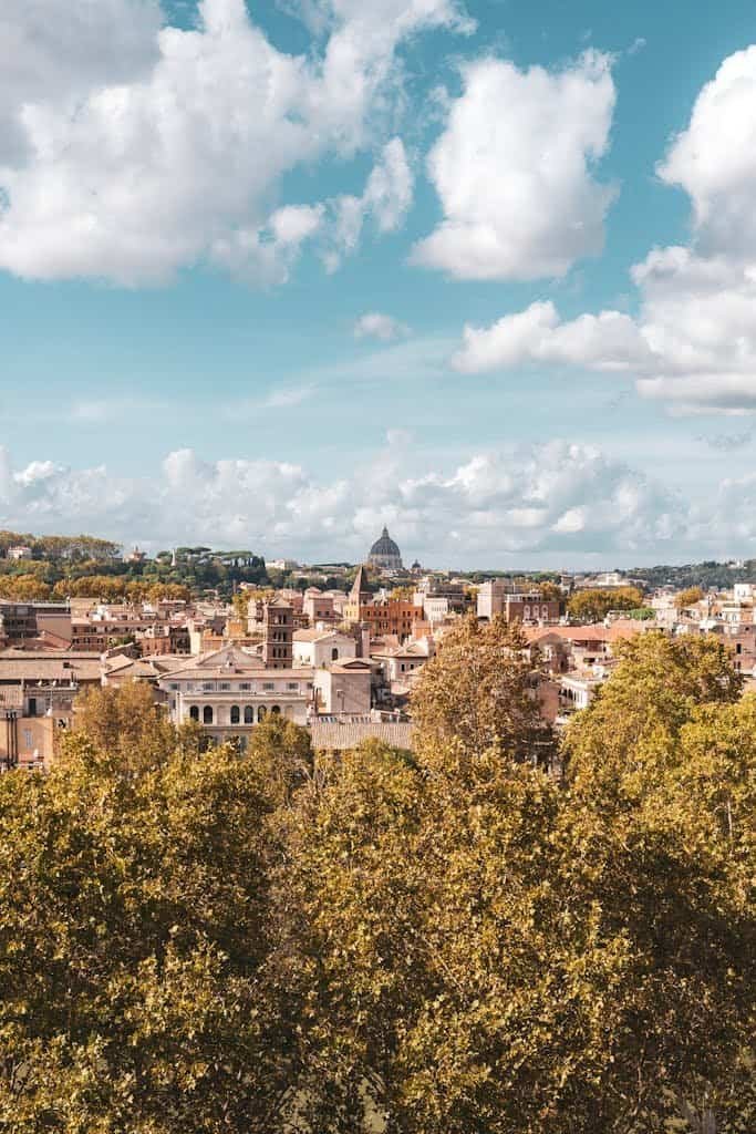 Rome cityscape, historic architecture, lush greenery, travel photography, Italy travel, city skyline, travel off the cuff.